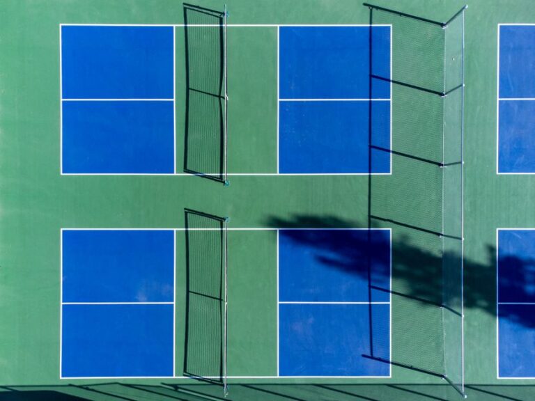 Player hitting a volley at the kitchen line