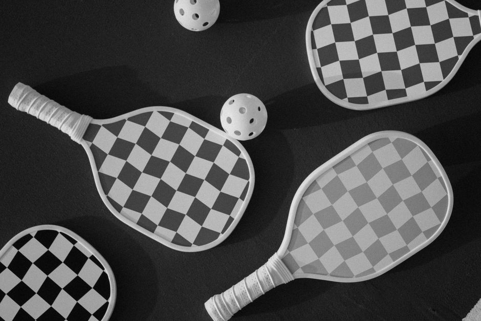 Pickleball paddles laid out for comparison alongside the Joola Perseus Pro V