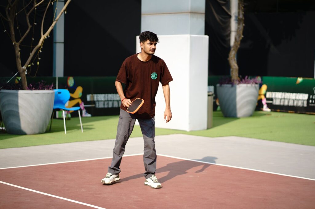 Player setting his feet early to avoid unforced errors in pickleball