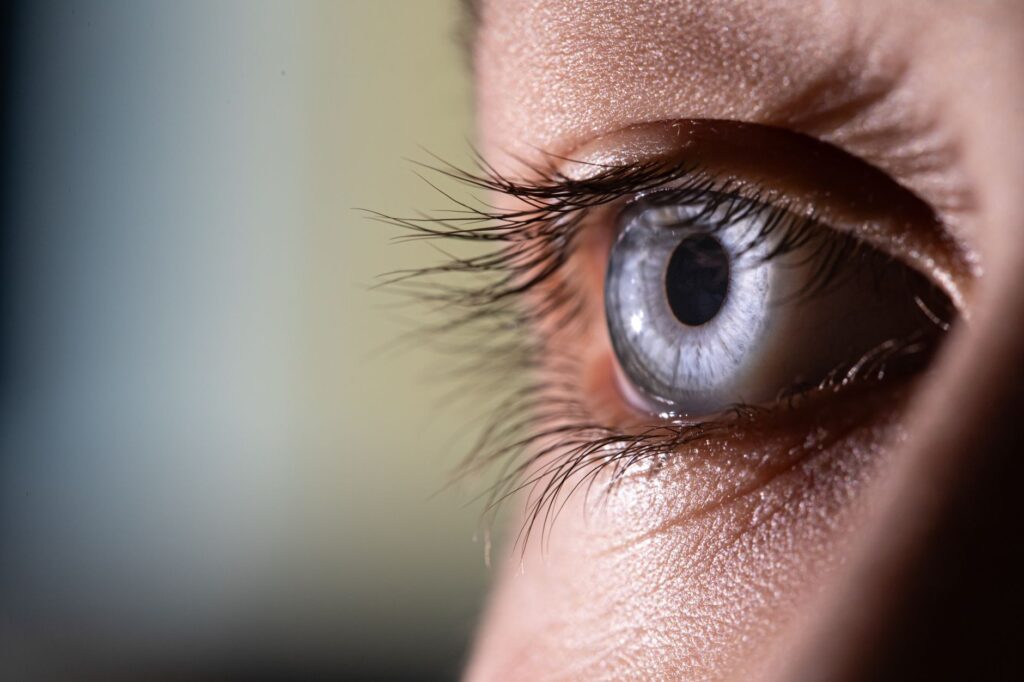 Macro close-up of a human eye, representing sports vision training for pickleball