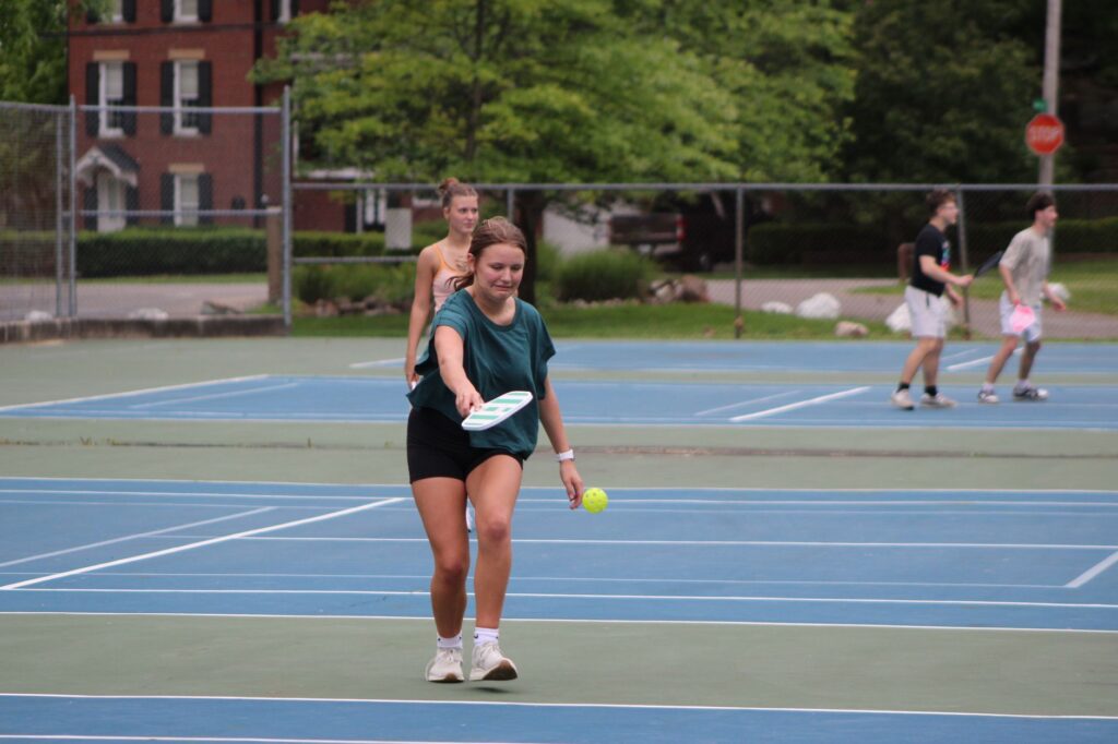 Pickleball in Brunswick, ME: a group of adults playing pickleball on an outdoor court