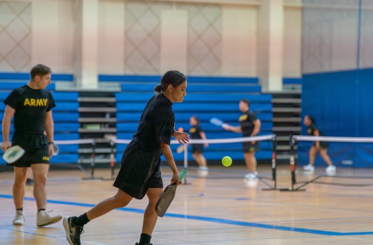 Players on several indoor courts in one gym, the multi-court indoor format Boston Pickle Club Windsor is building