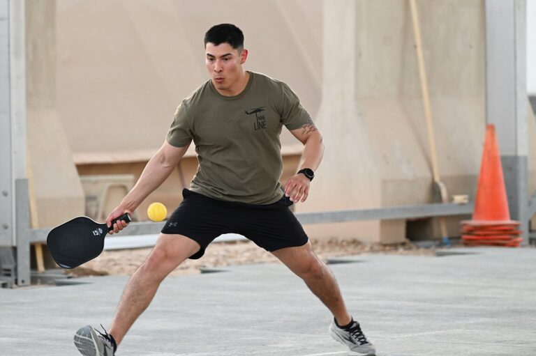 Player mid-forehand on a hard court, illustrating the largest pickleball facility in Connecticut