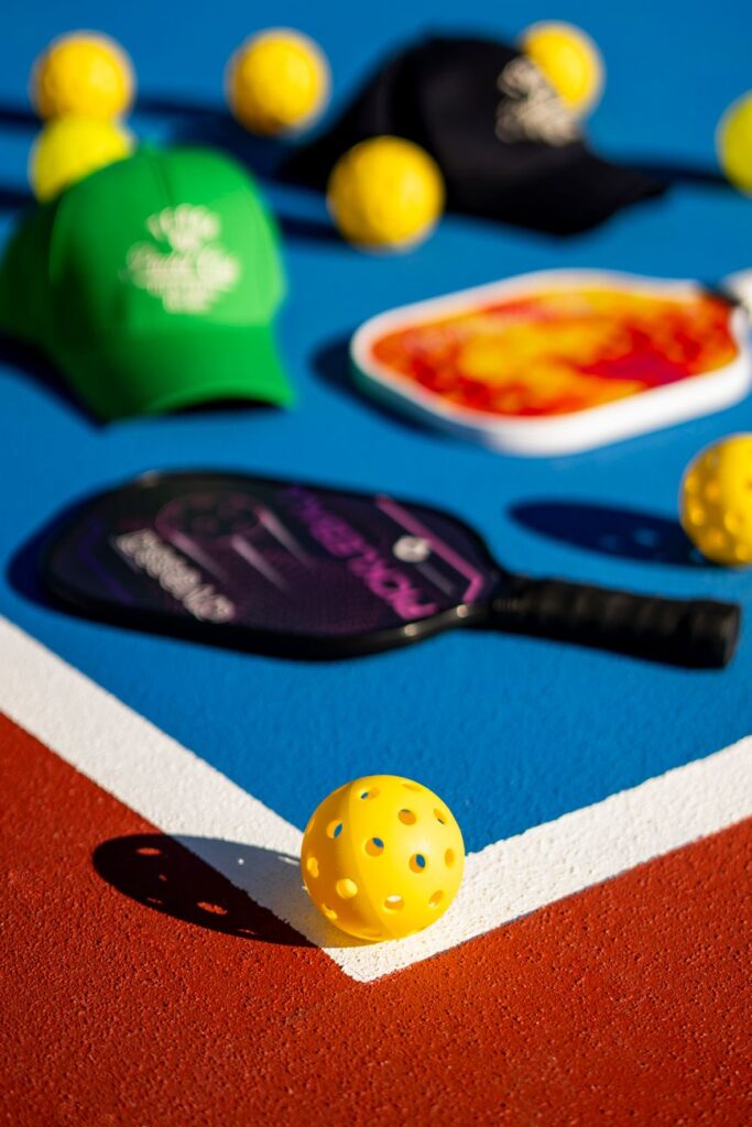 Pickleball paddles and balls on an outdoor court, illustrating the 2026 MLP Finals result