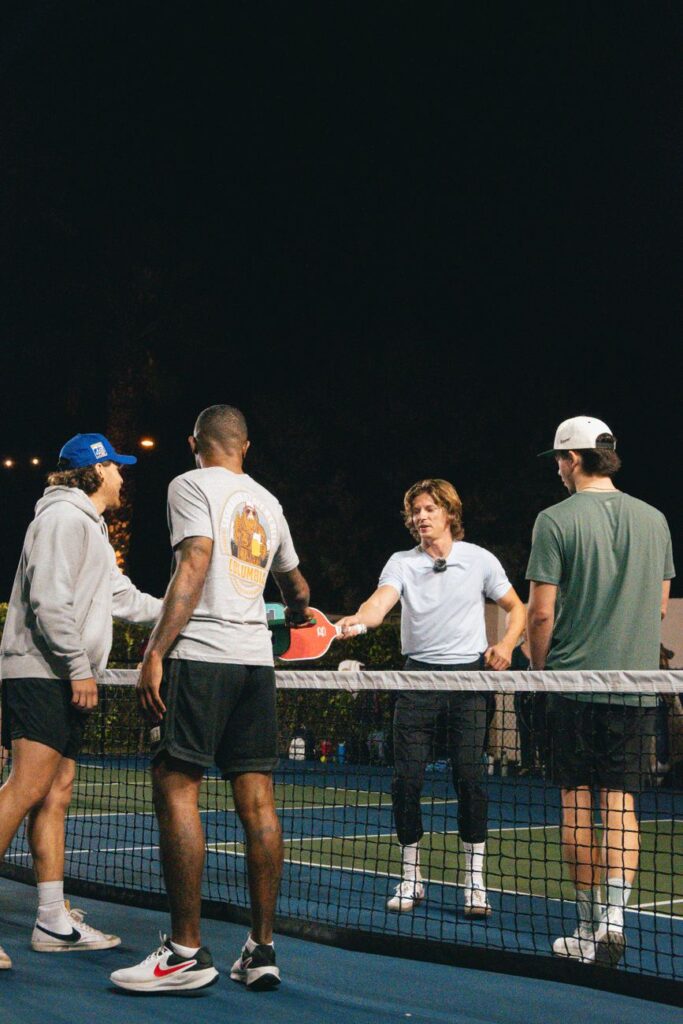 MLP Finals 2026 results: four pickleball players tap paddles at the net after a night match