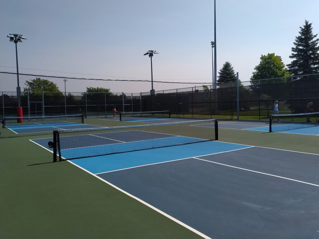 Fenced outdoor town courts, the kind of setup for pickleball in East Greenwich RI
