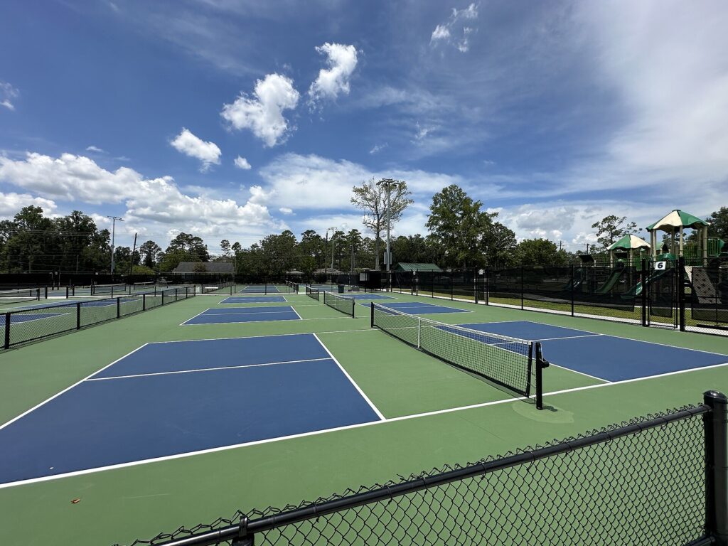 Pickleball in Laconia NH guide: outdoor pickleball courts with permanent nets on a summer day