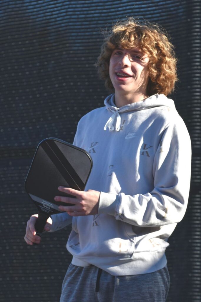 Player holding a paddle before a game of pickleball in Lebanon NH
