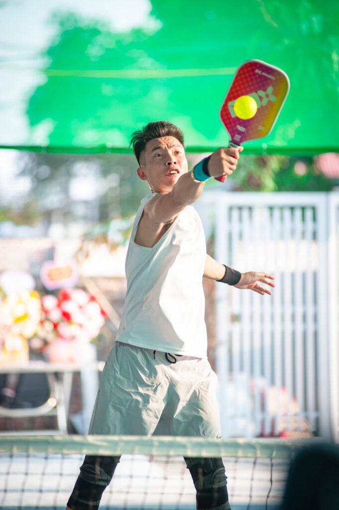 A squared-top paddle meeting the ball, one of the pickleball paddle trends of 2026