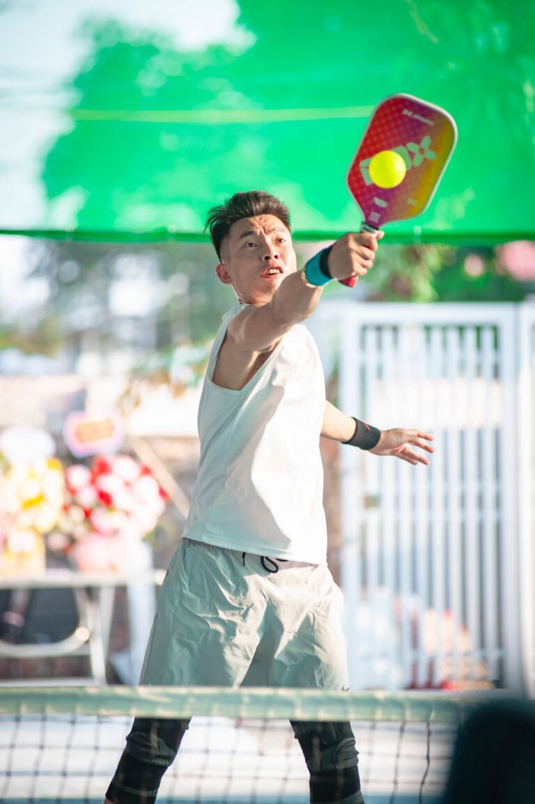 A squared-top paddle meeting the ball, one of the pickleball paddle trends of 2026