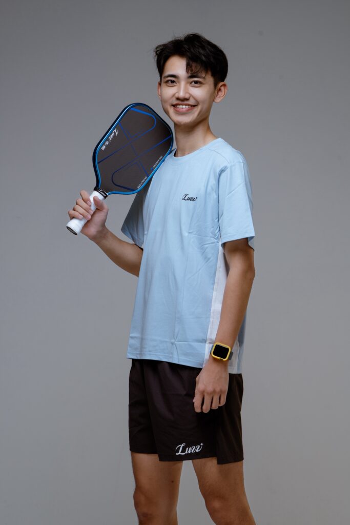A player holds a pickleball paddle at shoulder height, the kind of certified paddle the six zero coral pro now joins on the USA Pickleball list